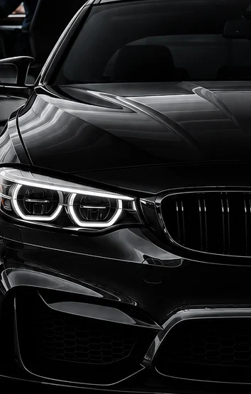 Dark car featured in MORE Automotive's service while you work branding